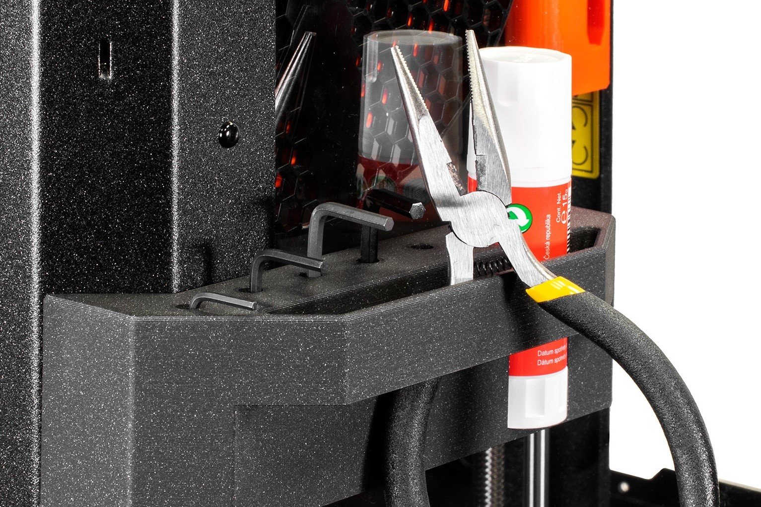 3d printed tool holder conected to the enclosure via mountingpoints